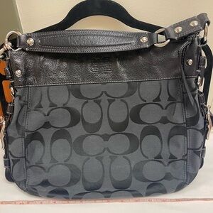 Used coach shoulder bag. Couple slight stains at bottom of bag.